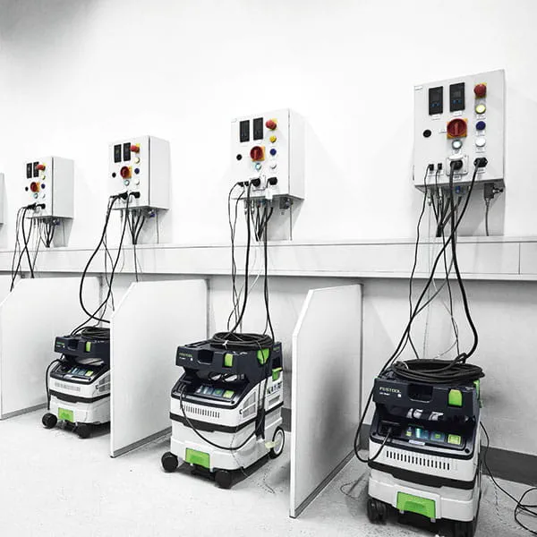 The Festool dust extractors in the test cabin