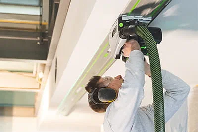 Using the Festool TSC 55 cordless plunge-cut saw for sawing work on the ceiling