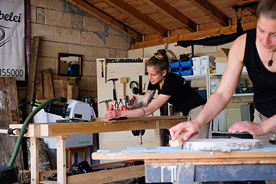 Two carpenters working with the Festool portable circular saw