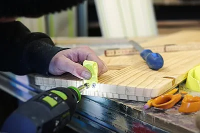 Maker Laura Kampf screwing a loop in tight using the Festool cordless screwdriver.