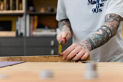 Jonas Winkler works a ledge using a Japanese saw