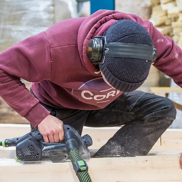 The wooden beams are worked using the Festool one-handed planer