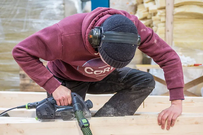 The wooden beams are worked using the Festool one-handed planer